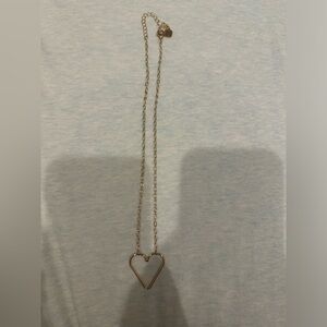Gold heart necklace.